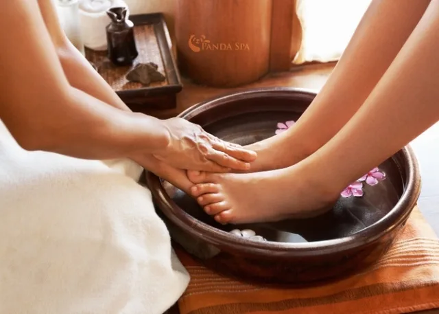 Herbal foot soak before foot massage photo